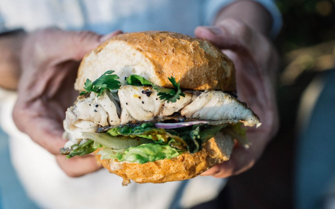 BBQ barramundi burger with grilled cos, grilled lemon and jalapeno tartare