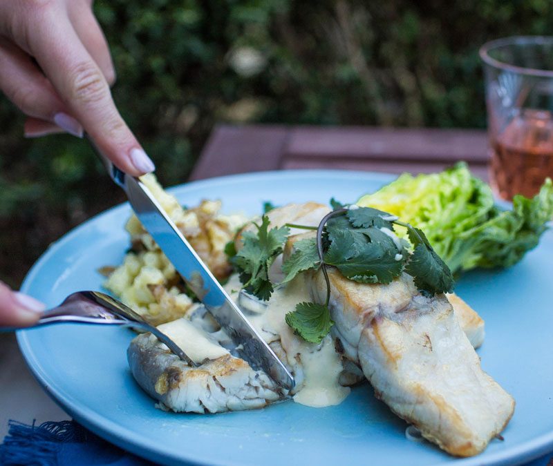 Crisp skinned barramundi with smashed potatoes and baby cos and mint salad with citrus dressing