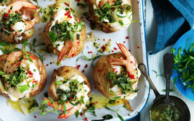 Salt baked potatoes topped with jalapeño butter and prawns